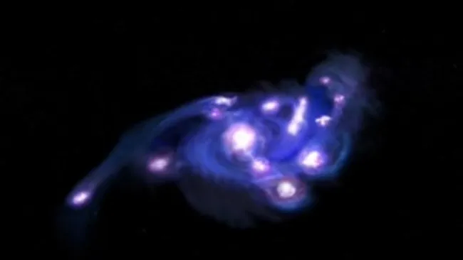 Astronomers Discover ‘Cosmic Grapes’ Galaxy Packed with 15 Star-Forming Clumps